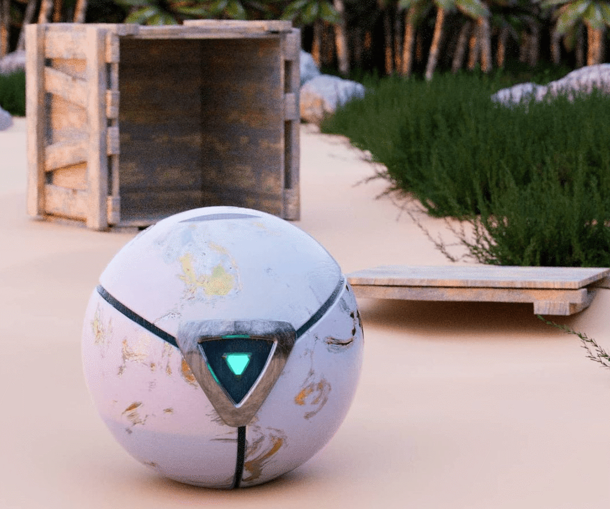 In the middle of the image shows a spherical white robot with a triangle 'eye' in the middle, it looks like it's on a beach with a wooden crate opened in the background